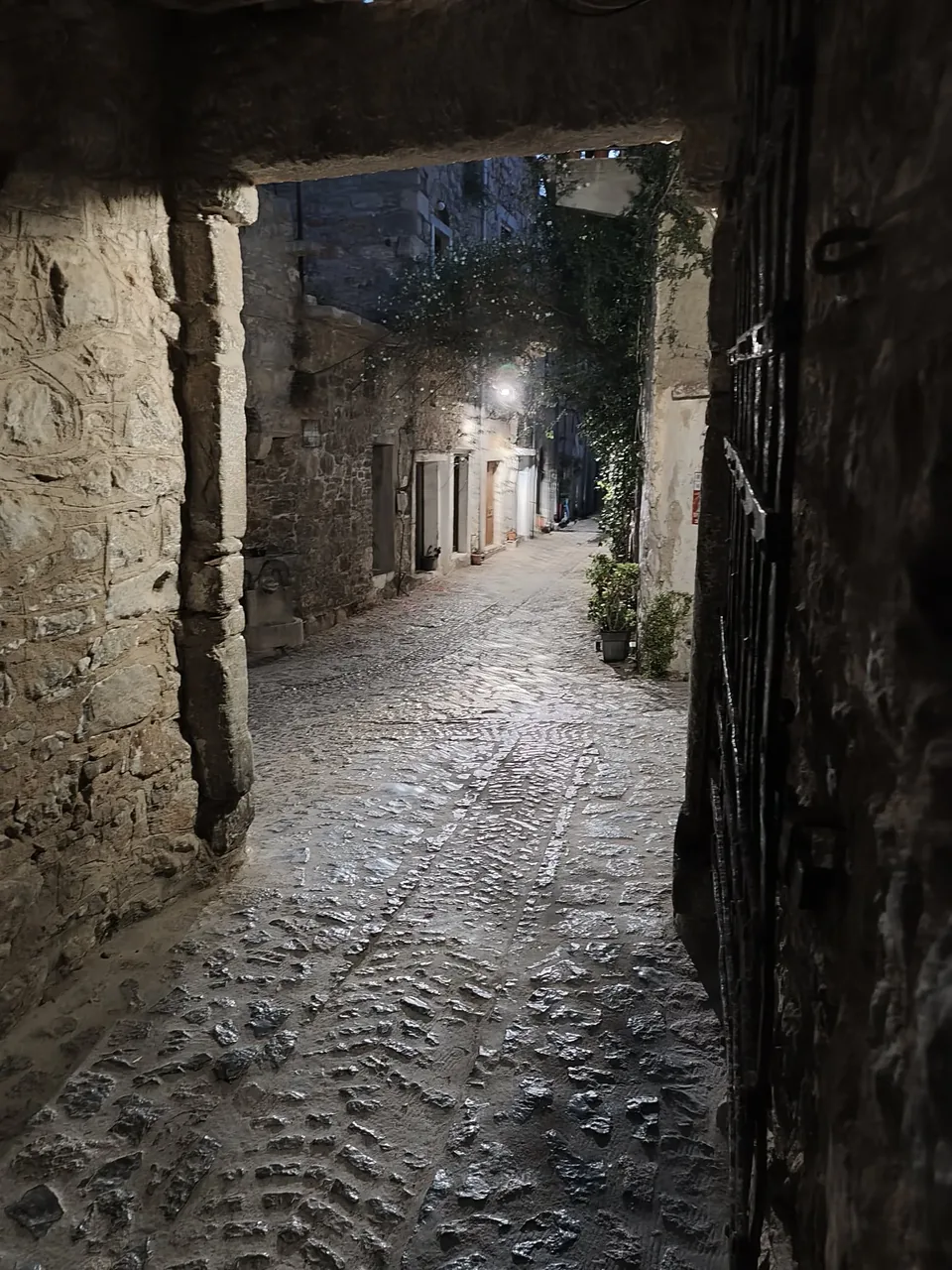 A quiet stone passage in Mesta at night